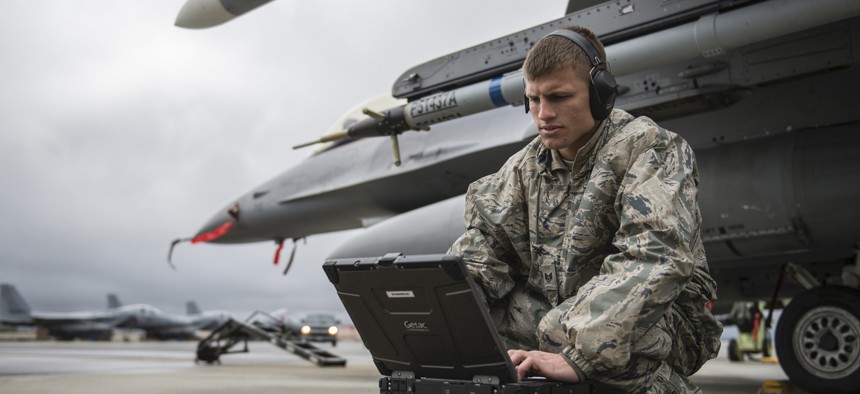 Staff Sgt. Zackery Coder checks computer data during Red Flag-Alaska 14-2, June 19, 2014, on Eielson Air Force Base, Alaska.