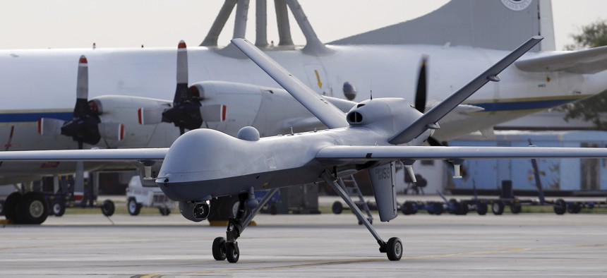 A Predator B unmanned aircraft taxis at the Naval Air Station, Tuesday, Nov. 8, 2011, in Corpus Christi, Texas. 