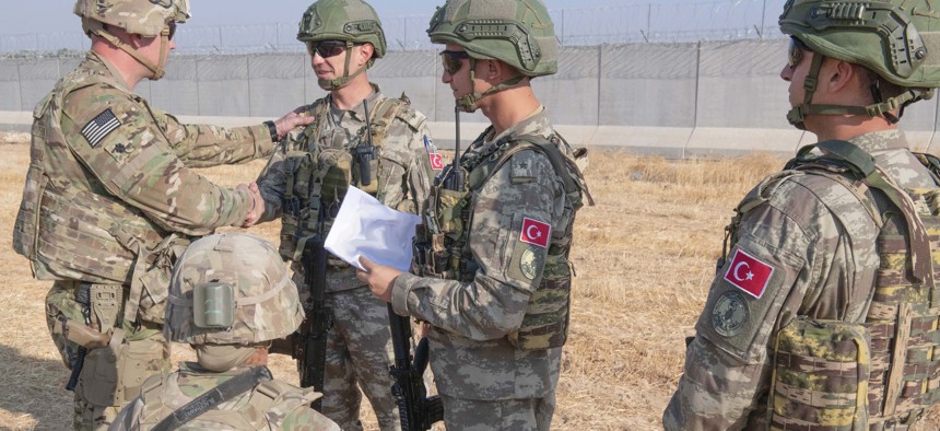 U.S. and Turkish military forces conduct the third ground combined joint patrol inside the security mechanism area in northeast Syria, Oct. 4, 2019.