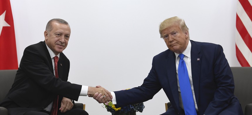 President Donald Trump, right, shakes hands with Turkish President Recep Tayyip Erdogan, left, during a meeting on the sidelines of the G-20 summit in Osaka, Japan, Saturday, June 29, 2019. 