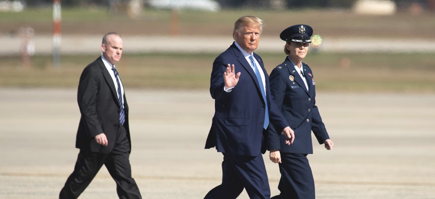 President Donald Trump waves as he walk towards Air Force One for a trip to Pittsburgh, Wednesday, Oct. 23, 2019, at Andrews Air Force Base, Md.