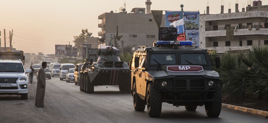 Russian forces patrol in the city of Amuda, north Syria on Oct. 24, 2019, part of a zone 30 kilometers (19 miles) deep along much of the northeastern border, under an agreement reached Tuesday by Russia and Turkey.