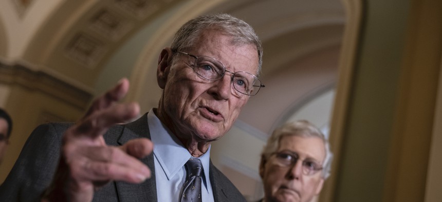 Senate Armed Services Committee Chairman Jim Inhofe, R-Okla., joined at right by Senate Majority Leader Mitch McConnell, R-Ky., speak to reporters on Capitol Hill in June 2019. 