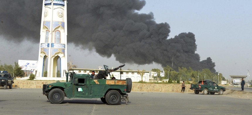 Afghan security forces arrive after a powerful explosion outside the provincial police headquarters in Kandahar province south of Kabul, Afghanistan, Thursday, July 18, 2019.