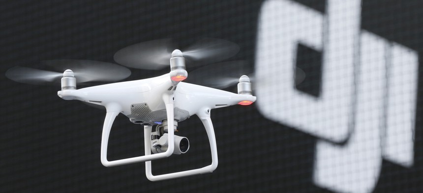 A Phantom 4, developed by major Chinese consumer-drone maker DJI, flies during its demonstration flight in Tokyo, Thursday, March 3, 2016.