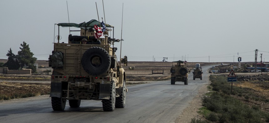 In this Monday, Oct. 28, 2019 photo, U.S. forces patrol Syrian oil fields.