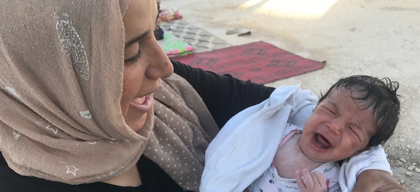 Batoul and her baby in 2017, shortly after they fled the ISIS capital of Raqqa, Syria.. 