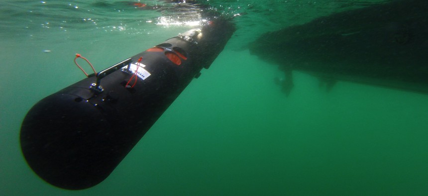 U.S. and Italian sailors deploy a Remote Environmental Measuring Units (REMUS) 100 unmanned underwater vehicle off Sesimbra, Portugal, Sept. 19, 2019. 