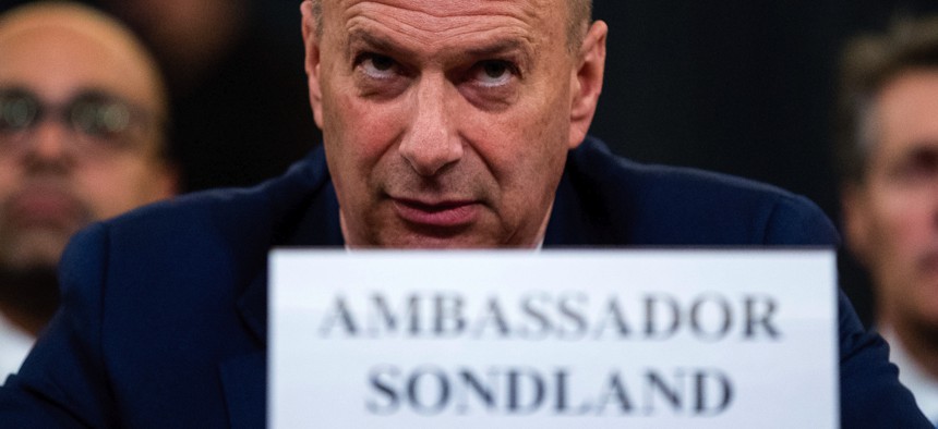 Ambassador Gordon Sondland, U.S. Ambassador to the European Union, center, appears before the House Intelligence Committee on Capitol Hill in Washington, Wednesday, Nov. 20, 2019