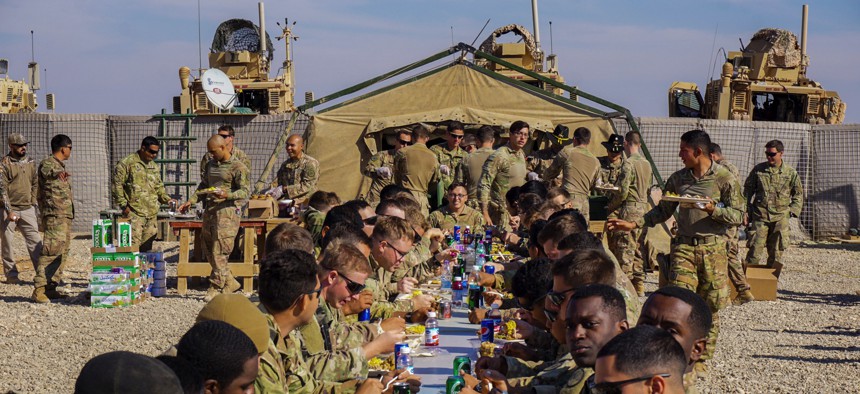 Soldiers assigned to 3rd Cavalry Regiment enjoy Thanksgiving dinner on Fire Base Saham, Iraq, Nov. 20, 2018. 