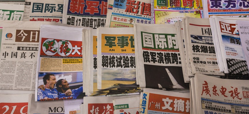 Newspapers on display in the city of Guangzhou, China.