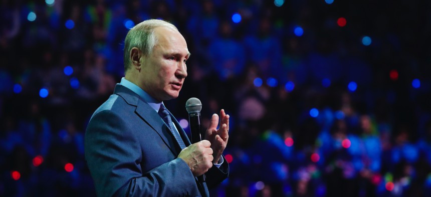 Russian President Vladimir Putin speaks during the International Volunteer Forum at the Olympic Park in Sochi, Russia, Dec. 5, 2019. 