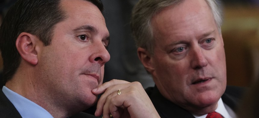 Rep. Devin Nunes, R-Calif, left, the ranking member of the House Intelligence Committee, speaks with Rep. Mark Meadows, R-N.C., as the House Judiciary Committee holds a hearing on impeachment on Dec. 4, 2019. 