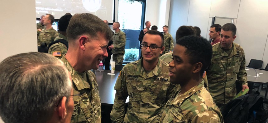 Lt. Gen. Stephen G. Fogarty, commander of Army Cyber Command, talks with soldiers in Augusta, Georgia, for the launch of a partnership with the Defense Digital Service at the Georgia Cyber Center in 2018. Lt. Gen. Stephen G. Fogarty, commander of Army Cyb