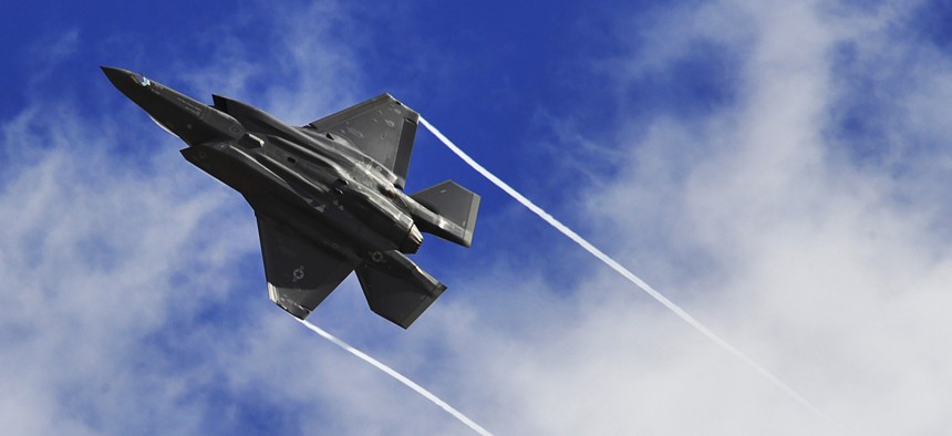 An F-35 Lightning II performs a maneuver over Luke Air Force Base, Ariz.