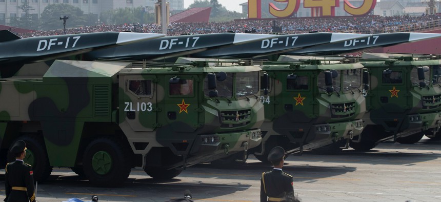 Chinese military vehicles carrying DF-17 missiles roll during a parade to commemorate the 70th anniversary of the founding of Communist China in Beijing, Tuesday, Oct. 1, 2019.