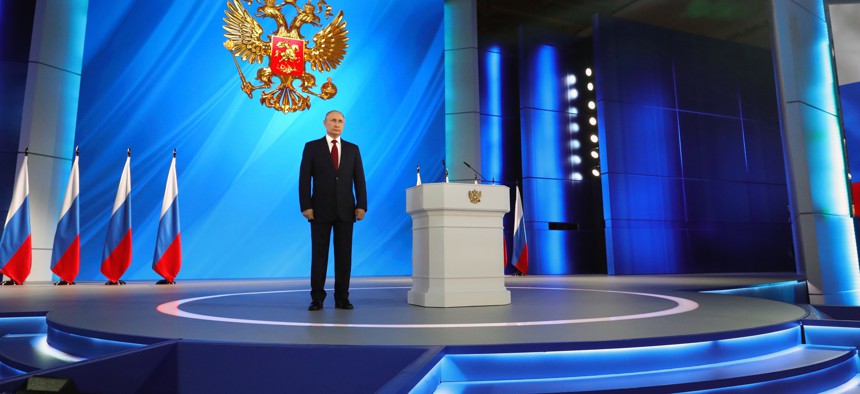 Russian President Vladimir Putin listens the national anthem after his speech to the State Council in Moscow, Russia, Wednesday, Jan. 15, 2020. Putin proposed changing the Russian Constitution to increase the powers of parliament and the Cabinet.
