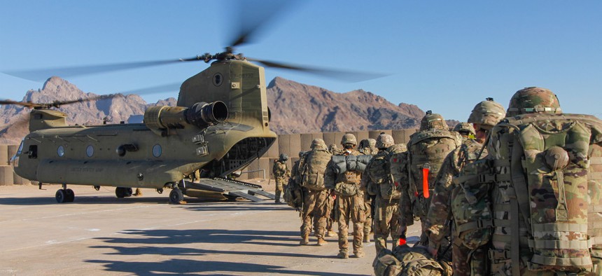 Soldiers assigned to the 101st Resolute Support Sustainment Brigade load onto a Chinook helicopter to head out and execute missions across Afghanistan, Jan. 15, 2019.