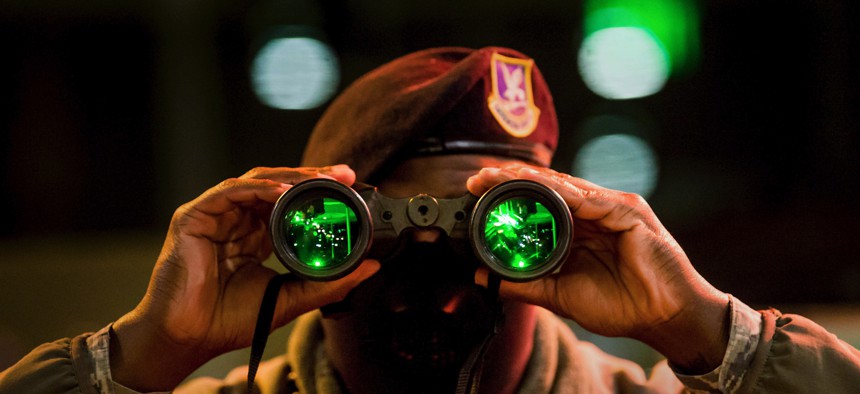 Air Force Airman 1st Class Richard Scott, a security forces installation entry controller, uses night vision binoculars during a night shift at the North Gate at the U.S. Air Force Academy in Colorado Springs, Colo., Jan. 7, 2020.