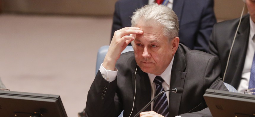 Ukraine's U.N. Ambassador Volodymyr Yelchenko views a video monitor as he listens to U.N. humanitarian chief Stephen O'Brien report to the Security Council in a live broadcast on the bombing of a hospital in Syria, Thursday April 28, 2016 at U.N. HQ.