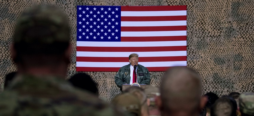 President Donald Trump speaks at a hangar rally at Al Asad Air Base, Iraq, Wednesday, Dec. 26, 2018.