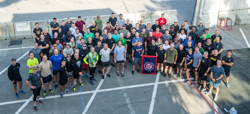 Defense Secretary Mark T. Esper participates in a PT session with service members and Civilians at Camp Resolute Support, Kabul, Afghanistan, Oct. 21, 2019.