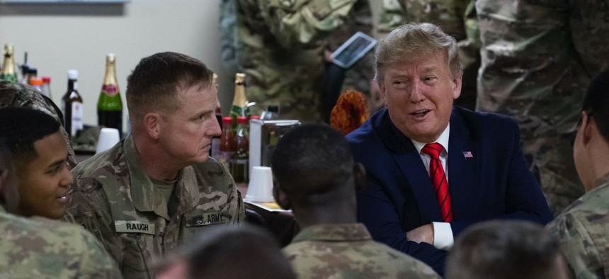 President Donald Trump speaks with members of the military during a surprise Thanksgiving Day visit, Thursday, Nov. 28, 2019, at Bagram Air Field, Afghanistan.