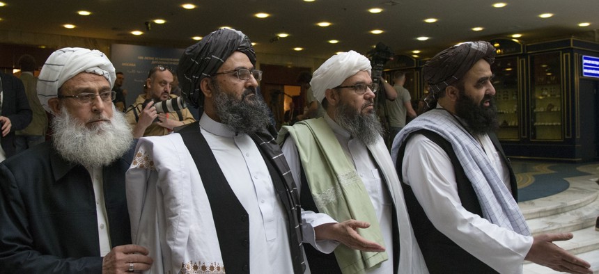In this file photo taken on Tuesday, May 28, 2019, Mullah Abdul Ghani Baradar, the Taliban group's top political leader, second from left, arrives with other members of the Taliban delegation for talks in Moscow, Russia.
