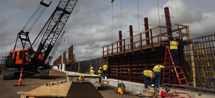 Construction crews work to erect levee wall system in a remote area south of Weslaco, Texas in the U.S. Border Patrol’s Rio Grande Valley Sector. Jan. 13, 2019.