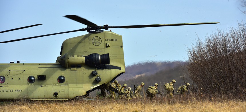 U.S. Army Paratroopers assigned to 1st Battalion, 503rd Infantry Regiment, 173rd Airborne Brigade, exit from a 12th Combat Aviation Brigade CH-47 Chinook helicopter, during Exercise Eagle Sokol at Pocek Range in Slovenia, Mar. 25, 2019.