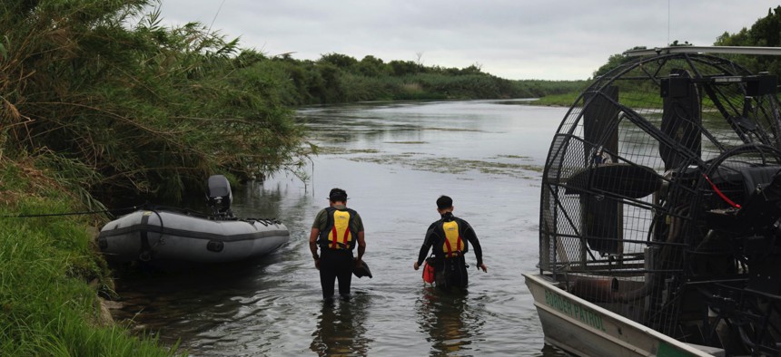 This July 2, 2019 photo provided by the U.S. Customs and Border Protection Agency shows a U.S. Border Patrol Del Rio Sector Dive Team searching for a 2-year-old Haitian girl in Rio Grande River in Del Rio, Texas.