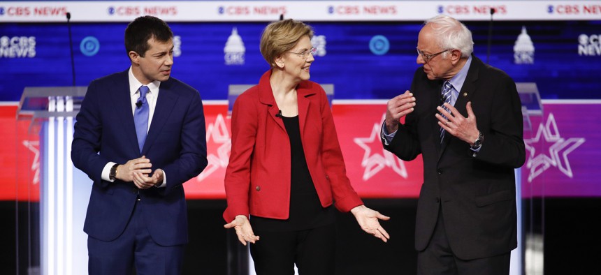 From left, former South Bend Mayor Pete Buttigieg, Sen. Elizabeth Warren, D-Mass., and Sen. Bernie Sanders, I-Vt., on stage as they participate in a Democratic presidential primary debate at the Gaillard Center, Tuesday, Feb. 25, 2020, in Charleston, S.C.