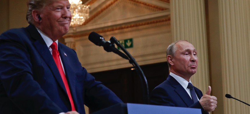 Russian President Vladimir Putin, right, and U.S. President Donald Trump give a joint news conference at the Presidential Palace in Helsinki, Finland, on Monday, July 16, 2018. 