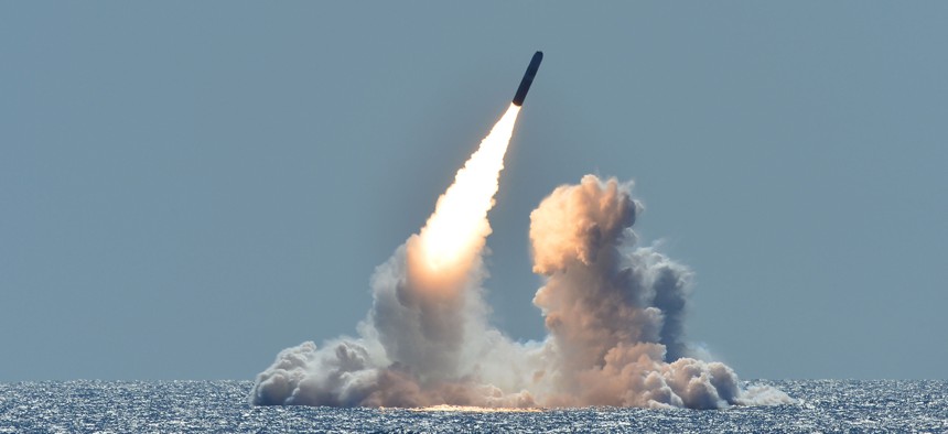An unarmed Trident II D5 missile launches from the Ohio-class ballistic missile submarine USS Nebraska off the coast of California.