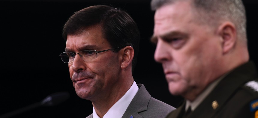Defense Secretary Mark Esper, left, and Chairman of the Joint Chiefs of Staff Army Gen. Mark Milley, right, during a briefing at the Pentagon in Washington, Monday, March 2, 2020.