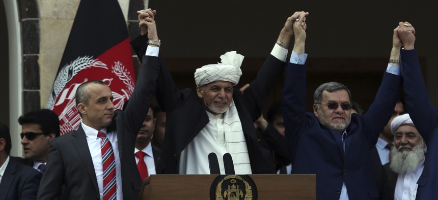 Afghan President Ashraf Ghani, center, second Vice President Sarwar Danish, right, and first Vice President Amrullah Saleh, left, at an inauguration ceremony at the presidential palace in Kabul, Afghanistan, Monday, March 9, 2020.