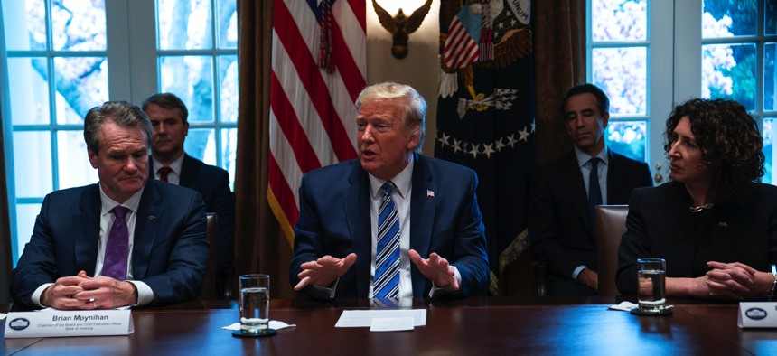 President Donald Trump speaks during a meeting with banking industry executives about the coronavirus, at the White House, Wednesday, March 11, 2020, in Washington.