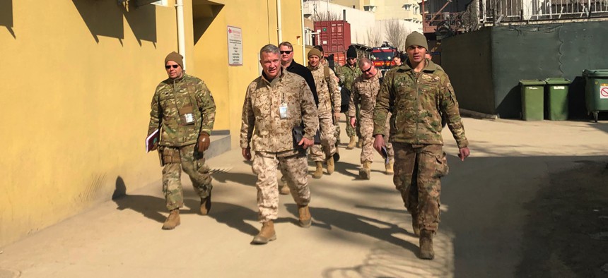 Marine Gen. Frank McKenzie, center, top U.S. commander for the Middle East, makes an unannounced visit, Friday, Jan. 31, 2020 in Kabul, Afghanistan.