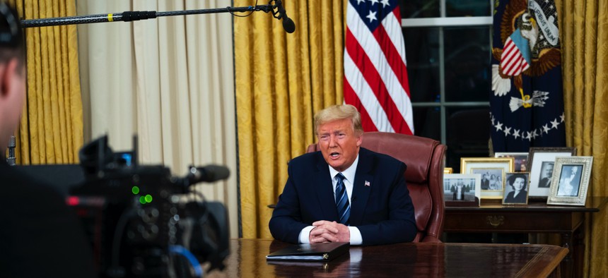 President Donald Trump speaks in an address to the nation from the Oval Office at the White House about the coronavirus Wednesday, March, 11, 2020, in Washington.