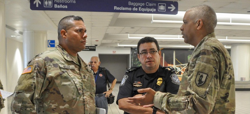 Puerto Rico National Guard and local law enforcement helped establish the action plan to be taken with passengers arriving at Luis Muñoz Marín International Airport in Carolina, Puerto Rico, to detect any suspected cases of COVID-19, March 16. 
