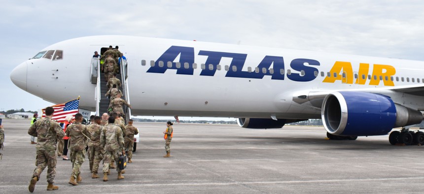 Soldiers from 2nd Armored Brigade Combat Team, 3rd Infantry Division board an Atlas Air plane at Hunter Army Airfield, Ga., March 3. 