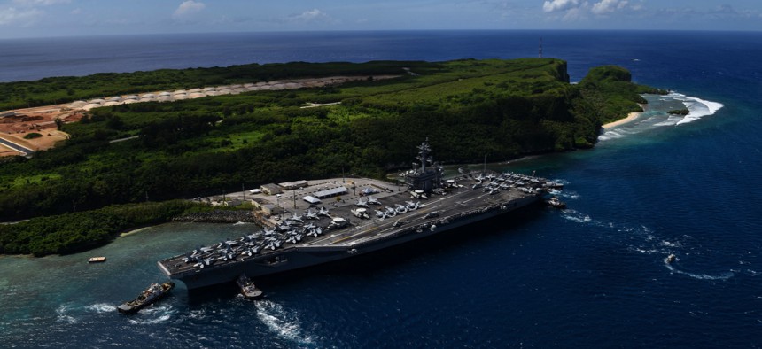 This 2017 photo shows the USS Theodore Roosevelt leaving the pier at Naval Base Guam.