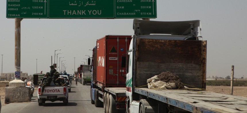 Trucks wait to cross the Afghanistan-Iran border in Zaranj, Afghanistan, May 10, 2011. The crossing is part of a busy trade route between Central Asia and the Middle East.