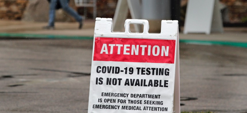 A sign alerting the public that COVID-19 testing is not available is posted outside the entrance to the Exeter Hospital Exeter, N.H., Thursday, April 9, 2020.