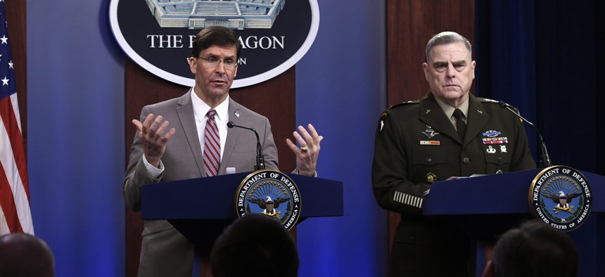 In this Monday, March 2, 2020 file photo, U.S. Defense Secretary Mark Esper, left, speaks during a briefing with the Chairman of the Joint Chiefs of Staff Army Gen. Mark Milley, at the Pentagon in Washington. 