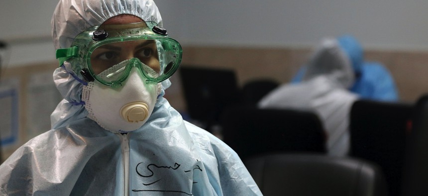 A nurse wears protective gear in a ward dedicated for people infected with the new coronavirus, at a hospital in Tehran, Iran, Sunday, March 8, 2020. 