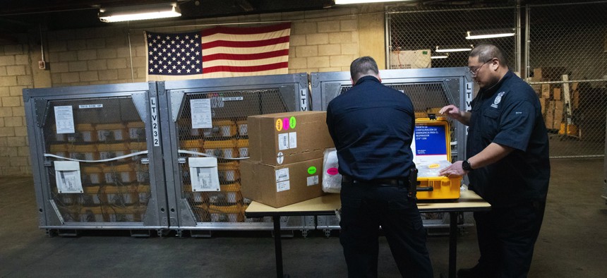 Coordinators at the New York City Emergency Management Warehouse, pack up a ventilator, part of a shipment of 400, that arrived Tuesday, March 24, 2020 in New York.