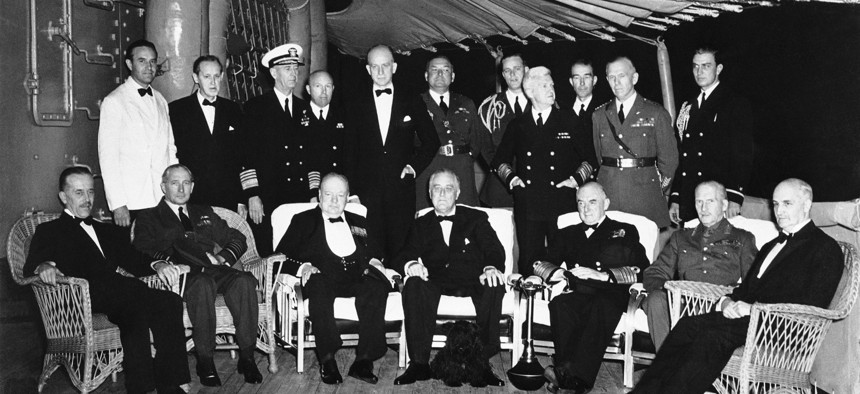 President Franklin D. Roosevelt entertained at dinner for British Prime Minister Winston Churchill aboard the U.S. cruiser Augusta on Aug. 9, 1941, somewhere in the Atlantic.