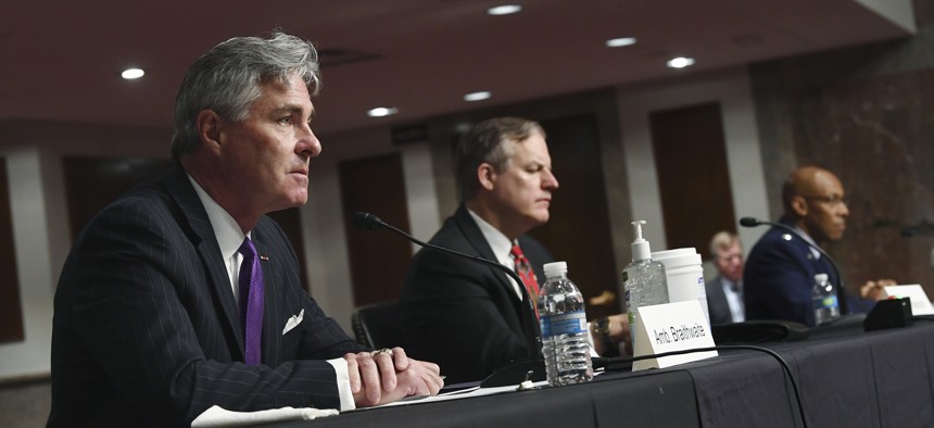 Kenneth Braithwaite, left, nominated to be Navy Secretary, James Anderson, nominated to be Deputy Under Secretary of Defense for Policy and Gen. Charles Q. Brown, Jr., right, nominated to be Air Force Chief of Staff, testify to senators on May 7, 2020.