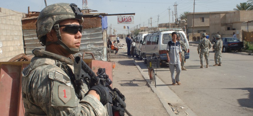 Pvt. Anthony Salazar, Bravo Company, 1st Battalion, 28th Infantry Regiment, 4th Brigade Combat Team, 1st Infantry Division pulls security during a patrol in the Furat area of Baghdad, Iraq on May 8, 2007